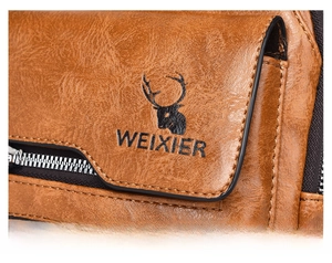 Close-up of brown litchi pattern leather chest bag with deer logo and zipper detail