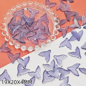 Macro view of purple gradient fishtail charms for DIY jewelry 19x20x4mm size