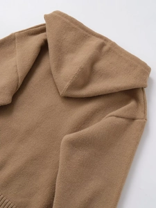 Close-up of dark camel knit hoodie showing fabric texture and hood neckline details