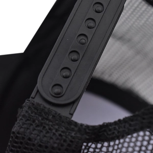 Close-up of adjustable black snapback closure and breathable mesh on baseball cap