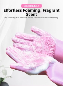 Close-up of pink silicone pet grooming glove creating rich foam for bathing