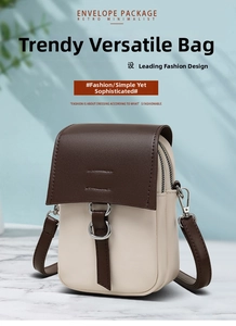 Detailed shot of two-tone crossbody bag with dark brown flap and cream leather body
