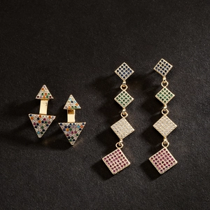 18K gold plated geometric earrings with vibrant colorful zircons on black background
