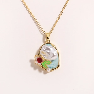 Detail of baroque pearl pendant with blue enamel and red flower on golden chain