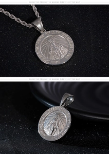 Macro view of religious Virgin Mary relief pendant with engraved prayer on round metal disk