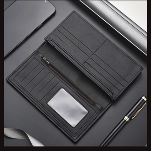 Interior detail of long leather wallet featuring multiple card slots and zipper pocket