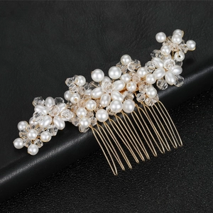 Handmade bridal hair comb with white pearls and crystals on a gold metal base