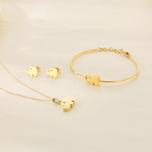 Detailed set of golden elephant necklace, earrings, and bracelet with crystals