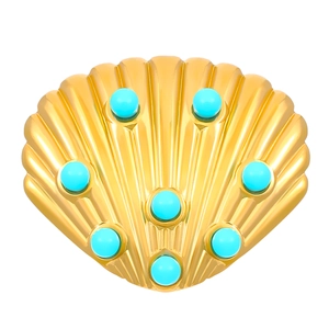 Macro view of a gold shell-shaped ring with radiant texture and turquoise stones