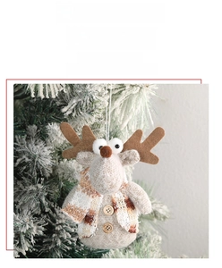 Detailed reindeer plush ornament with tweed fabric and a classic plaid scarf for Christmas