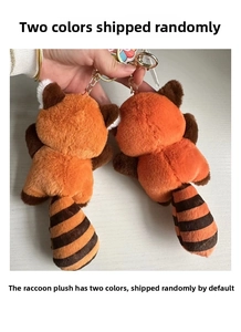 Rear view of cute plush raccoon keychains with striped tails and golden metal hooks