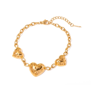 Gold hollow heart charm bracelet in stainless steel with adjustable lobster clasp closure