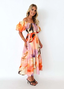 Detail of off-the-shoulder floral maxi dress with puff sleeves and layered skirt