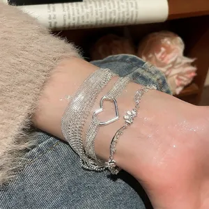 Elegant multi-layer silver bracelet set with heart pendant and floral lace chain for women