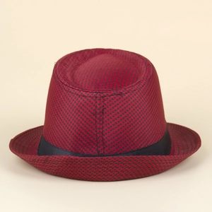 Detail of red and black houndstooth jazz hat with a stylish black ribbon band accent