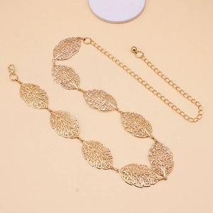 Detail of golden metal waist chain with hollow leaf charms and lobster clasp closure