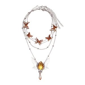 Silver multi-layer necklace featuring red enamel butterflies and yellow waterdrop pendants