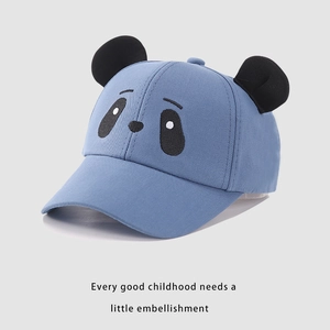 Detail of baby baseball cap with 3D panda ears and sky blue cotton fabric texture