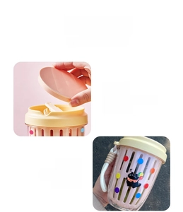 Detail of portable salad cup showing hidden cutlery storage and cute cat graphics