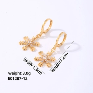 Detailed view of snowflake tassel earrings with size dimensions and weight info
