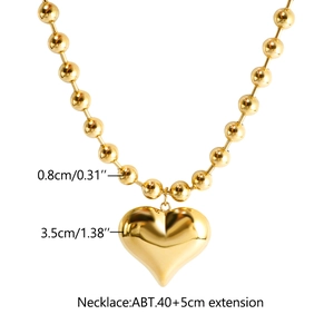 Detailed view of 18K gold heart pendant necklace with bead chain dimensions 3.5cm and 0.8cm