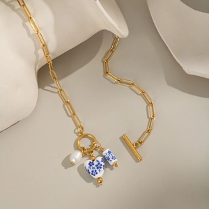 Blue and white porcelain flower necklace with OT buckle and gold paperclip chain