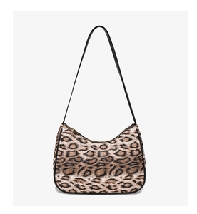 Macro view of leopard print crescent bag showing texture and golden zipper detail