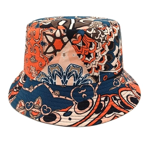 Detailed view of bohemian mandala print on bucket hat with vibrant navy and orange tones