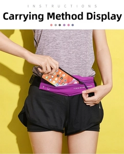 Close-up of slim purple running belt with reflective strip holding a smartphone