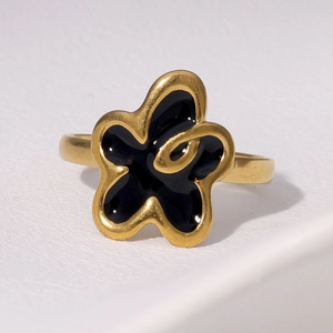 Minimalist flower-shaped open ring in gold and black enamel with center swirl texture