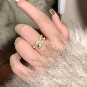 Gold plated snake ring with cubic zirconia micro-paving and green gemstone eyes