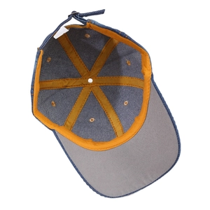 Deep blue denim baseball cap featuring internal yellow stitching and adjustable metal buckle