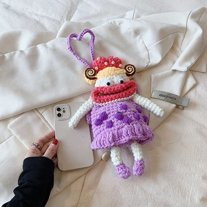 Handmade purple crochet sausage mouth phone bag with pearl strap on white background