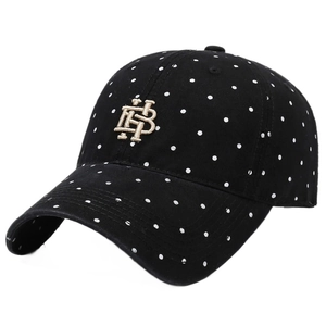 Vintage black washed cotton baseball cap with white polka dots and golden HB embroidery