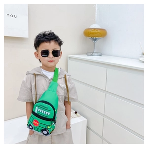 Detail of green school bus crossbody bag for kids with adjustable strap and stop sign