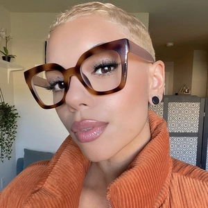 Close-up of stylish oversized cat-eye glasses with brown tortoiseshell frame pattern
