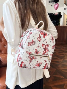 White butterfly printed backpack for women with golden zippers and fabric straps