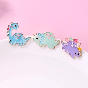 Cute enamel dinosaur brooches including blue brontosaurus and green triceratops pins