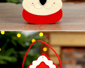 Close-up of stitched felt Christmas gift bag featuring cartoon Santa and reindeer details