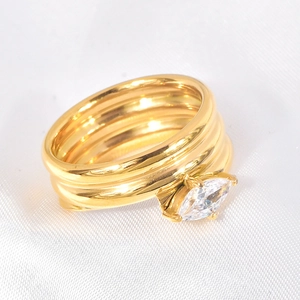 Multi-layer gold-plated titanium ring with marquise cut cubic zirconia stone