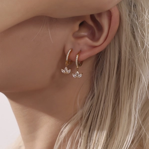 Elegance with 18K gold clover earrings featuring micro-pave white zircon floral studs