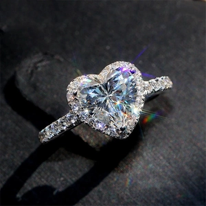 Elegant heart-shaped halo diamond ring in white gold finish with shimmering accents