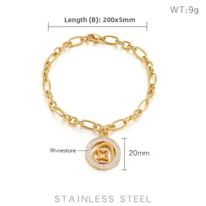 Detail of a gold stainless steel chain bracelet with a rhinestone heart star pendant