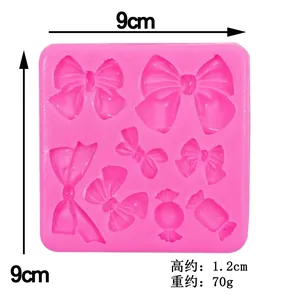 Pink silicone fondant mold featuring assorted bow and candy shapes for DIY cake decorating
