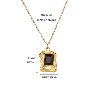 Detail view of gold necklace with black stone pendant and dimensional size specifications