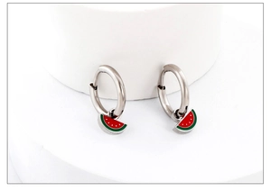 Detail view of silver earrings featuring vibrant red and green watermelon charms