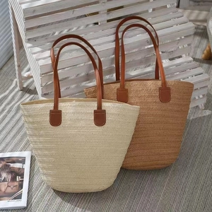 Vintage woven straw shoulder bags in cream and brown with premium leather handles