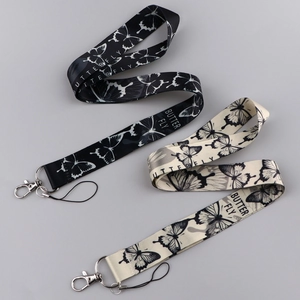 Butterfly printed phone lanyard keychain with metal clasp in black and off-white colors