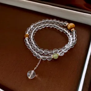 Double-layer crystal tiger eye beaded bracelet with gold metal charms and a luxury finish
