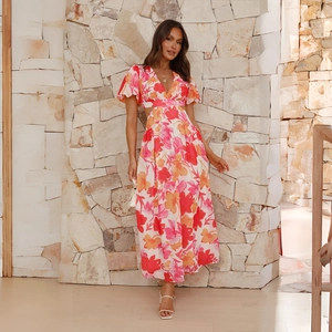 Elegant peach floral maxi dress with backless design and waist cutouts in light chiffon